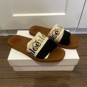 Chloé Woody Flat Canvas Logo Sandals in Black & White